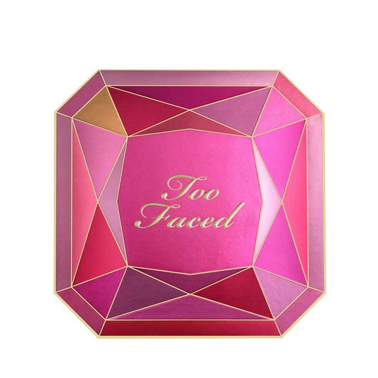 Pink geometric makeup product with 'Too Faced' branding on a white background