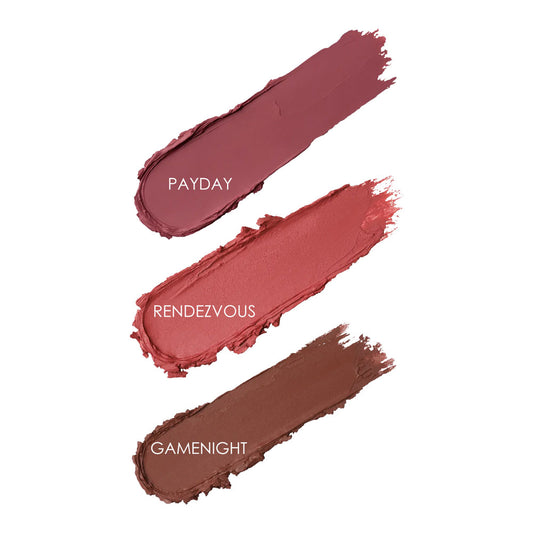 Three swatches of lipstick labeled 'Payday', 'Rendezvous', and 'Gamenight' on a white background.